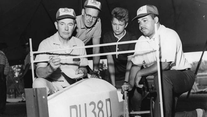 Robert Wrobel gets his car inspected for the 1965 Soap Box Derby.