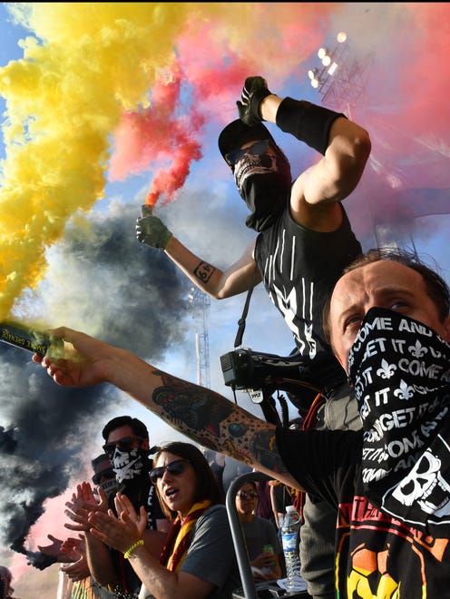 The Northern Guard and members of the mob light up smoke flares as the game starts between DCFC and Club Necaxa at Keyworth Stadium in Hamtramck.