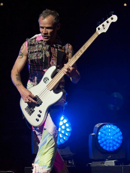 Red Hot Chili Peppers Bassist Flea (Michael Peter Balzary) performs.