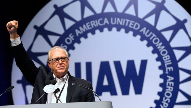 New UAW President Dennis Williams puts his fist up in solidarity with union brothers and sisters during his keynote speech at the  UAW's 36th Constitutional Convention 2014 at Cobo Center in Detroit, Thursday, June 05, 2014.