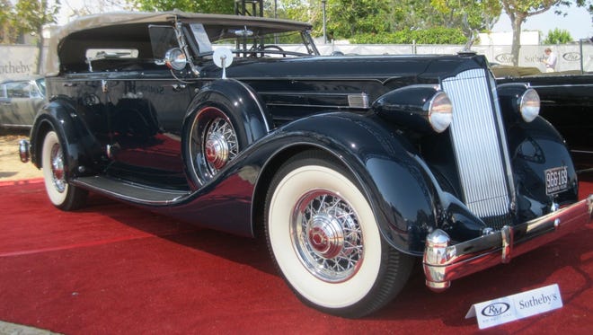 Still impressive after eight decades, a 1936 Packard Twelve Sport Phaeton with factory dual cowl sold for $682,000.
