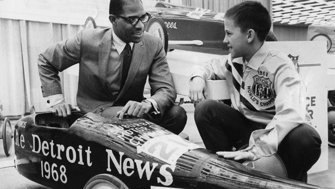 Hayes Jones, director of the New York City department of parks and recreation and was a 1964 Olympic Gold medal winner in the high hurdles, as well as a graduate of Pontiac Central High School and Eastern Michigan University, chats with Branch Lew, the 11-year-old winner of the 1968 All-American Soap Box Derby in Akron, Ohio.