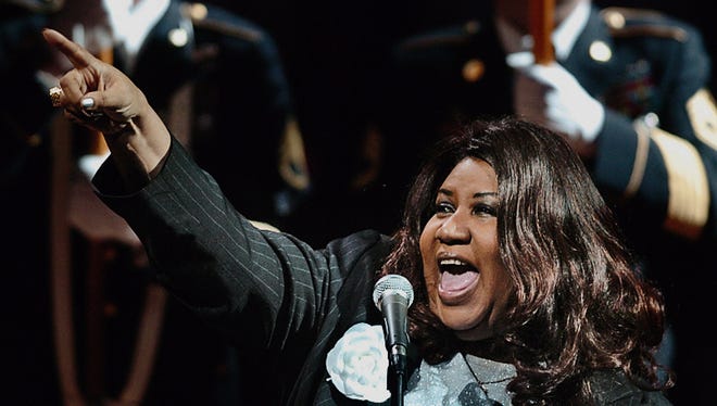 Aretha Franklin sings the national anthem as the Detroit Pistons take on the Los Angeles Lakers in Game 5 of NBA Finals on June 15, 2004.