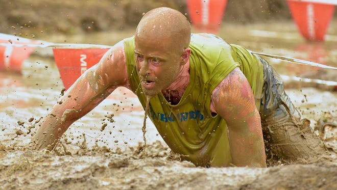 "Bath Needed," by Jim Ridley of Brighton.  Photographed at the Merrell Down and Dirty Obstacle Course Race at Kensington Metropark, "This competitor brought his A-game," Ridley said. "The competitors pushed themselves over 5K to 10K courses, including military fitness-inspired obstacles, mud crawls and strength challenges."