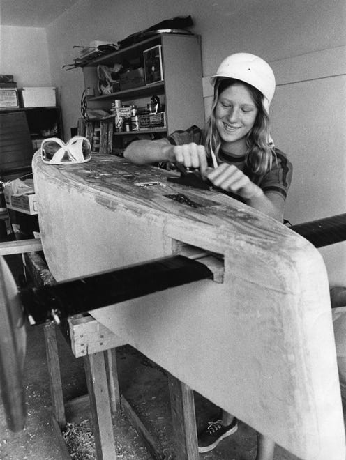 Deneas Terebus works on  her car in 1971.