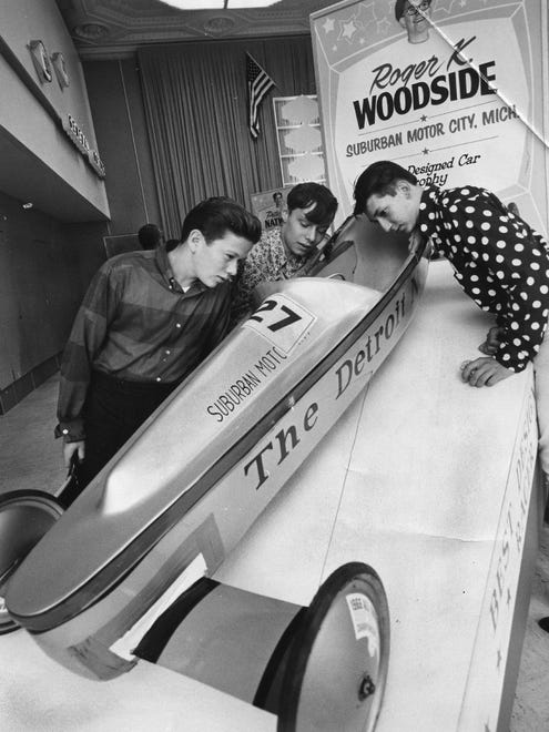 Frank Barry, left, William Klepsch and Joe Wagel, all 17 and of Detroit, examine the car that won Roger K. Woodside the best design prize at the 1960 Soap Box Derby. Klepsch was runner-up in the 1960 Soap Box Derby.