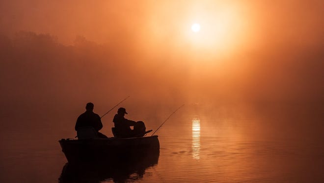 "Foggy Sunrise on Eagle Lake," by Steve Nowakowski of Lambertville, catches fishermen at dawn at Fort Custer State Park in Battle Creek. He was riding his bike back to his campsite when "at the boat launch I saw these two fisherman launching their boat. At first I road past the launch and then turned around and went back, wondering if there could be a possible picture in the fog over the lake."