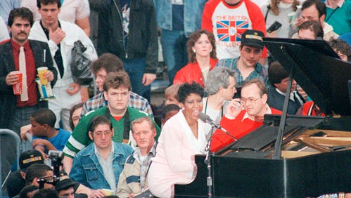 Motown legend Aretha Franklin sings the national anthem at the beginning of WrestleMania III, March 29, 1987. Traffic was so bad getting to the Silverdome, she arrived just on time, with no time for a sound check.