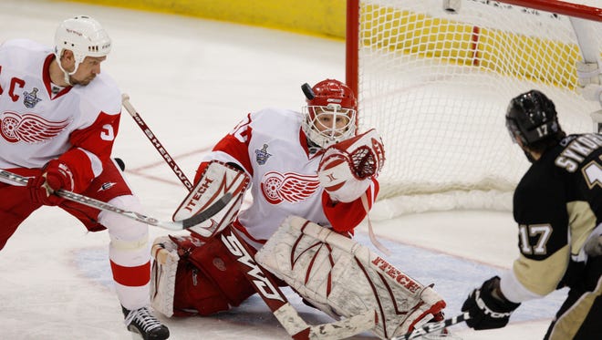 Chris Osgood makes a glove save during Game Six of the Stanley Cup Finals at Mellon Arena in Pittsburgh, June 4, 2008.