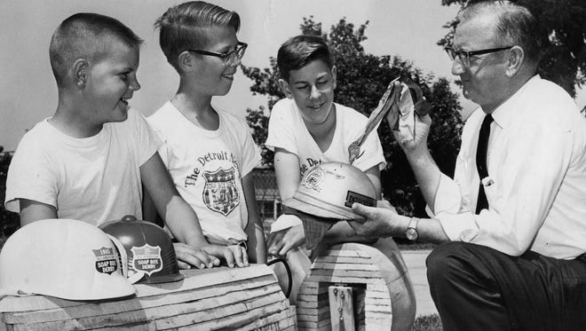 Brothers Mark, Paul and David Wooster of Royal Oak with "Red" Bonham, their Soap Box Derby area director in 1965.