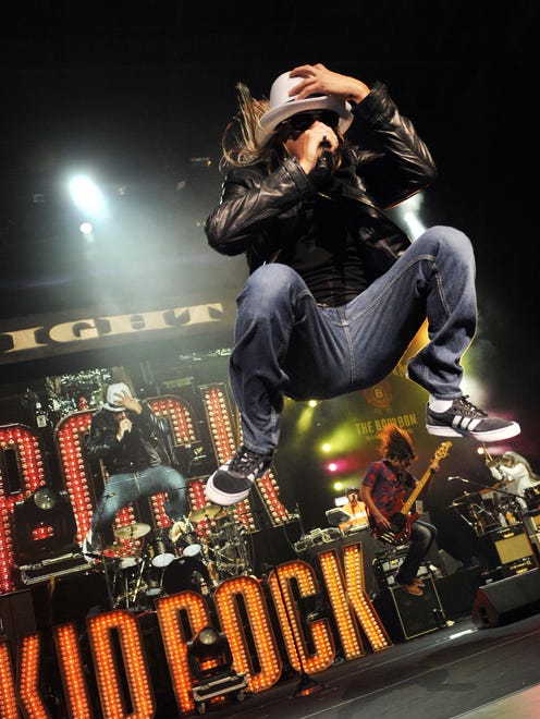 Kid Rock performs in front of a packed amphitheater during his eighth concert in 12 nights at DTE Energy Music Theatre in Clarkston.