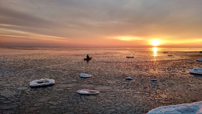 FOUR-SEASON FUN PEOPLE'S CHOICE WINNER: Heading Toward Sunrise," by Rose Morand of Bloomfield Hills. After helping her sister launch her kayak on the shore of Harbor Beach in the Thumb on Lake Huron, Morand watched her paddle away. "But it was freezing," she said, "so I snapped one single shot with my cellphone and ran inside."