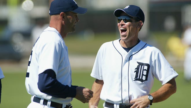 Alan Trammell,  manager of the Detroit Tigers, laughs at a comment made by Tigers Coach Kirk Gibson during workouts at Tigertown on February 23, 2003  in Lakeland, Florida.