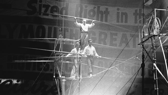 The day after the accident, in the tradition of the circus, Herman and Gunther Wallenda went back on the high wire in Detroit with Gene Mendez, 29, another famed aerialist. Topping this pyramid is Herman Wallenda, at rear is his son Gunther and leading the way is Gene Mendez.