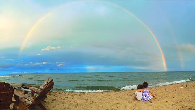 First place:  "Our Two Little Starrs," by Bethany Starr of Berkley.  A rainbow seen from their Oscoda vacation cottage "was was enough to send us all running outside," she said.  "And then the second rainbow became clearer and that was enough to make our on-the-go, awesome kiddos (son JJ, 2, and daughter Stella, 5) sit together, cuddle up, and really take in the view. It really was a magical moment that I'm glad I captured."