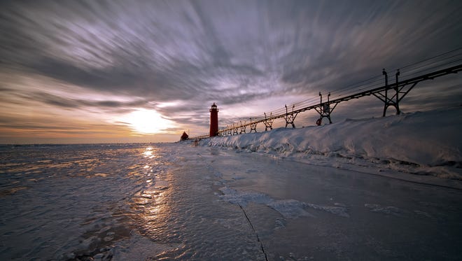 You can practically feel the cold, the wind and the sense of isolation in this photo of the Grand Haven pier by Jeff Vriezema of Wyoming, Mich.  "It doesn't look like it here, but there were over a dozen individuals walking through this shot," he said. "Because of a 30-second exposure, they're invisible as long as they stay moving.  I like to use long exposures because I love to see the effect it has with the clouds."