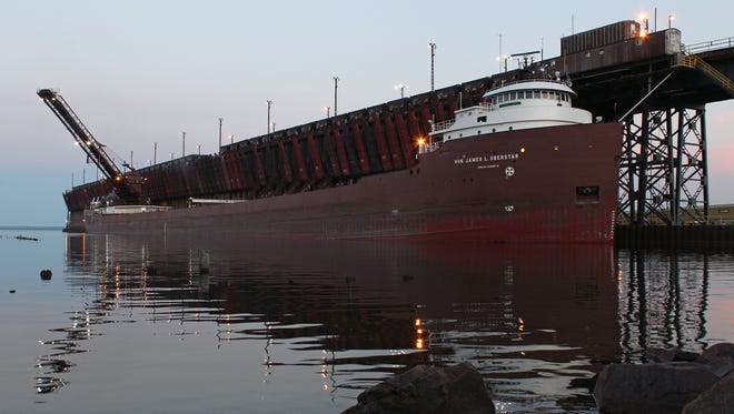 "I regularly photograph the freighters in Marquette," said Rod Burdick of Negaunee. This image of the laker Hon. James L. Oberstar loading taconite at the Upper Harbor in Marquette was captured about 15 minutes after sunset on a calm late spring evening.  The ore dock has been in operation since 1912.