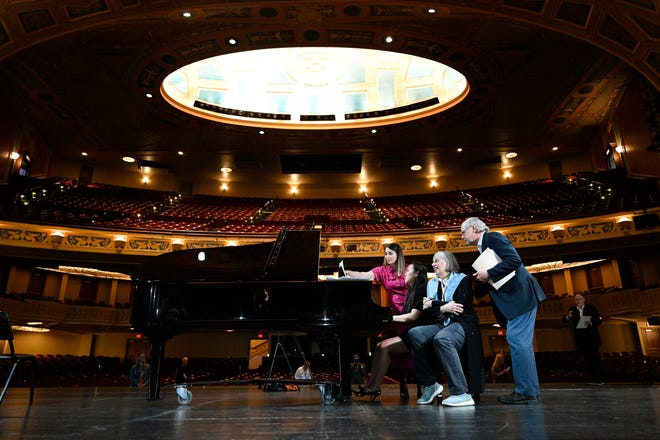 Soprano Lauren Wagner, second from right, rehearses "Somewhere Over the Rainbow," with pianist Tiffany Hyun, second from left, at the Detroit Opera House, Saturday, March 9, 2024, in Detroit. Helping them out are Wagner’s daughter, Katie Jacquez, far left, and Wagner’s husband, Geoffrey Jacquez.