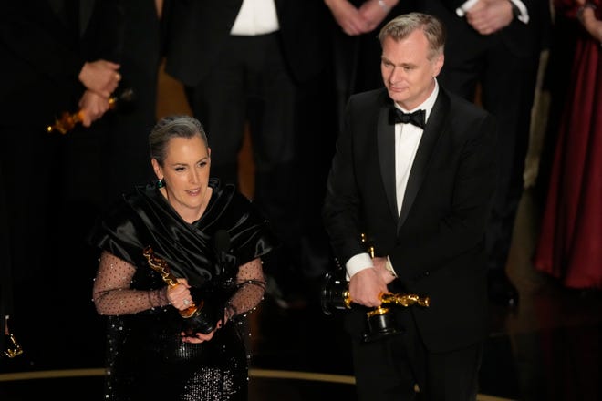 Emma Thomas, left, and Christopher Nolan accept the award for best picture for "Oppenheimer" during the Oscars on Sunday, March 10, 2024, at the Dolby Theatre in Los Angeles.