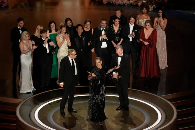 The cast and crew of "Oppenheimer" accept the award for best picture during the Oscars on Sunday, March 10, 2024, at the Dolby Theatre in Los Angeles.