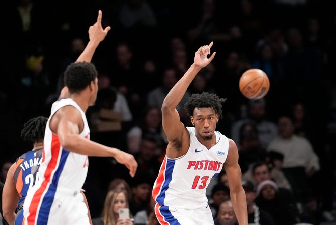Pistons center James Wiseman (13) and guard Jaden Ivey, left, react during the first half.