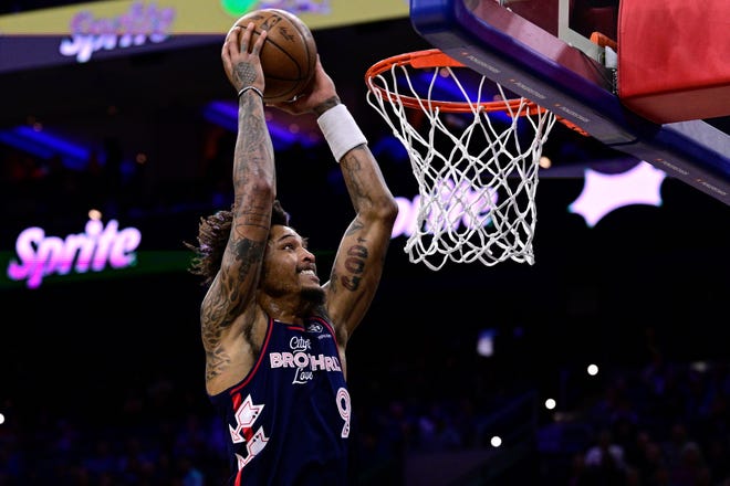 Philadelphia 76ers' Kelly Oubre Jr. goes up for a dunk during the first half.