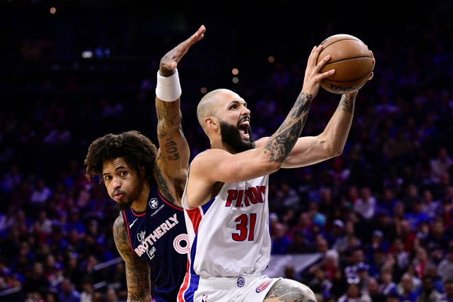 Detroit Pistons' Evan Fournier (31) goes up for a shot past Philadelphia 76ers' Kelly Oubre Jr. (9) during the second half.