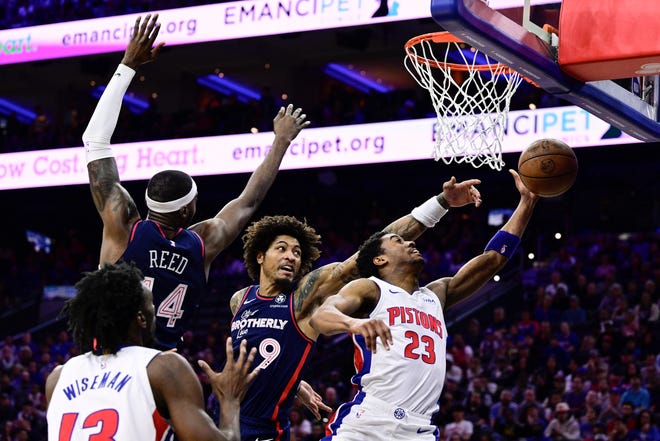 Philadelphia 76ers' Kelly Oubre Jr. (9) blocks a shot by Detroit Pistons' Jaden Ivey (23) during the second half.