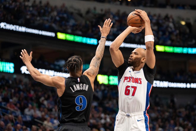 Detroit Pistons forward Taj Gibson (67) goes up to shoot over Dallas Mavericks guard A.J. Lawson (9) during the first half of an NBA basketball game Friday, April 12, 2024, in Dallas.