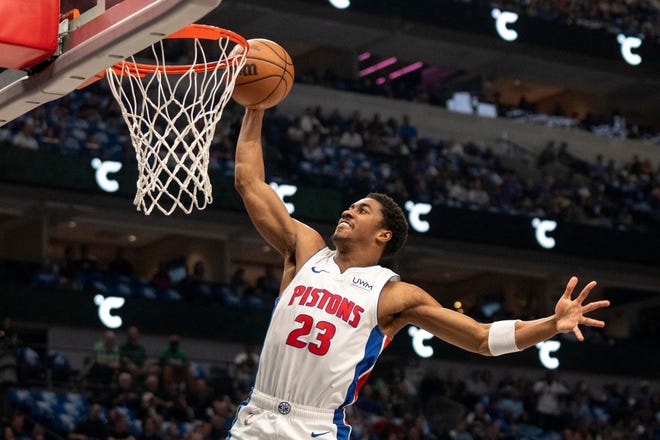 Detroit Pistons guard Jaden Ivey dunks during the first half of an NBA basketball game against the Dallas Mavericks, Friday, April 12, 2024, in Dallas.
