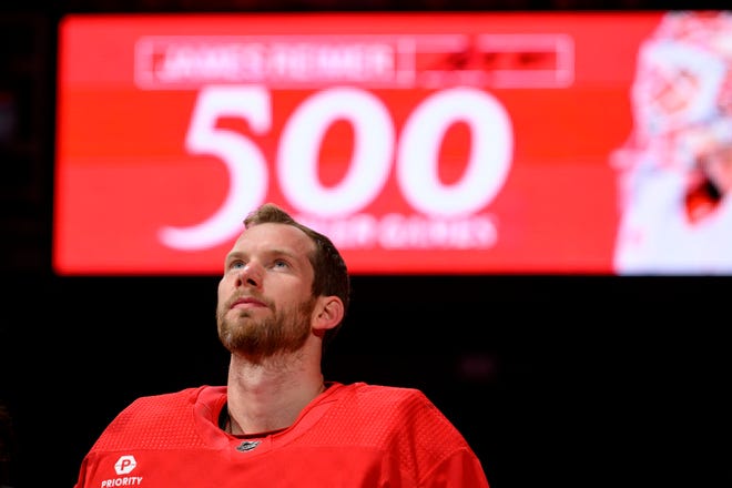 Detroit goaltender James Reimer takes part in a pregame ceremony honoring his 500th NHL game during the first period of a game between the Detroit Red Wings and the Montreal Canadiens at Little Caesars Arena, in Detroit, April 15, 2024. The Red Wings win, 5 to 4 in OT.