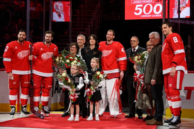 Friends and players take part in a pregame ceremony honoring Detroit goaltender James Reimer’s 500th NHL game.