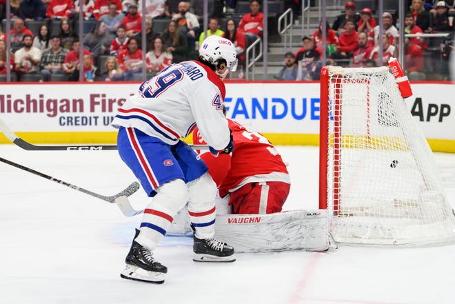 Montreal left wing Rafael Harvey-Pinard shoots the puck past Detroit goaltender Alex Lyon for a goal during the second period.