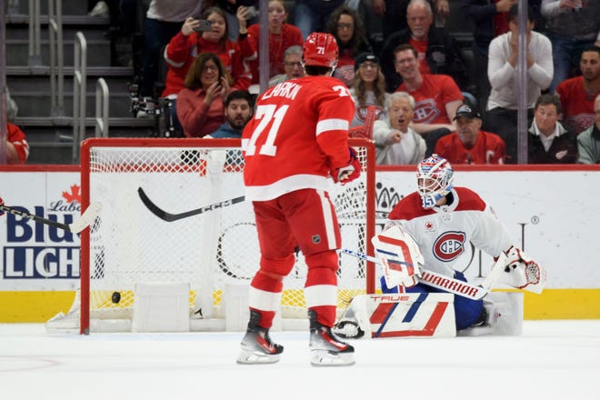 A shot by Detroit left wing Lucas Raymond (not pictured) flies past Montreal goaltender Sam Montembeault for the game winning goal during the overtime period.