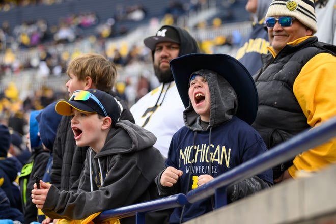 Fans cheer in the first quarter of the annual spring game at Michigan Stadium.