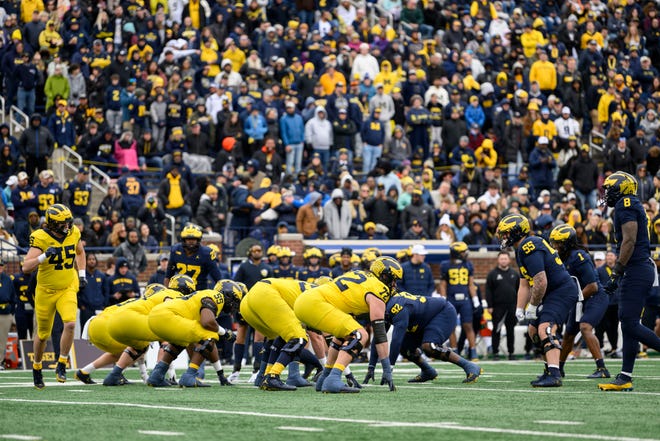 Team Maize and Team Blue line up in the first quarter of the annual spring game at Michigan Stadium.