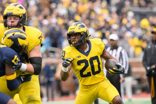 Team Maize running back Kalel Mullings runs the ball in the second quarter of the annual spring game at Michigan Stadium.
