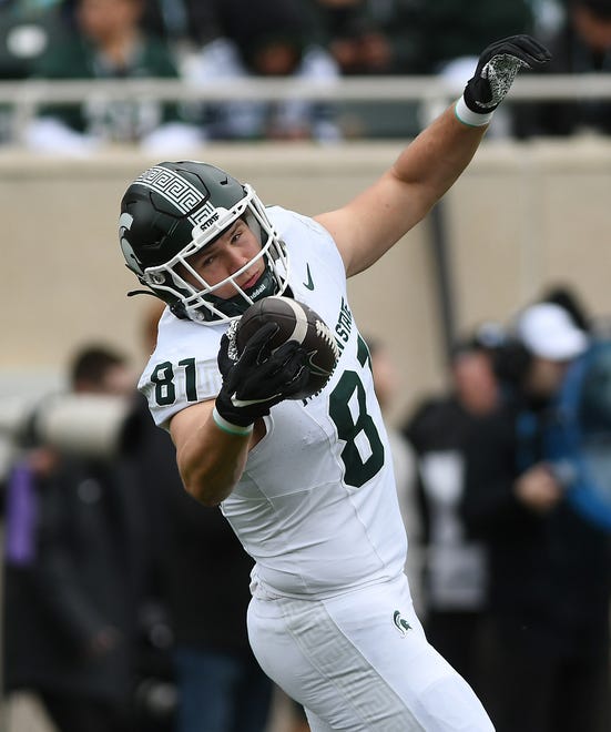 Tight end Michael Masunas pulls in a one-handed reception during the Michigan State football's spring showcase/scrimmage at Spartan Stadium.
