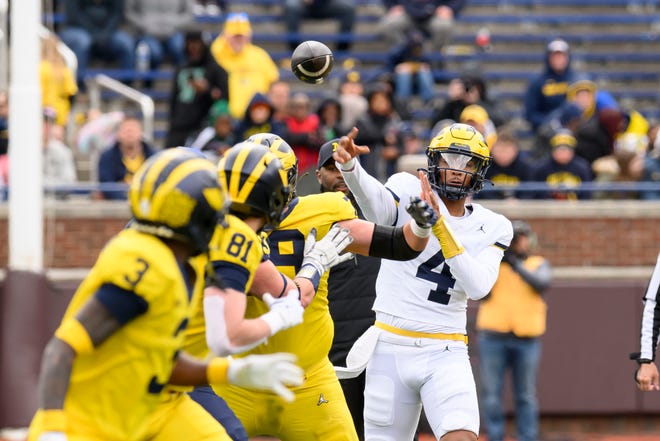 Team Maize quarterback Jayden Denegal throws a pass in the third quarter of the annual spring game at Michigan Stadium.