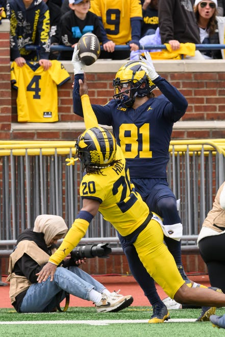 Team Blue wide receiver Peyton O'Leary can’t complete this pass while under pressure from Team Maize defensive back Jyaire Hill in the third quarter of the annual spring game at Michigan Stadium.