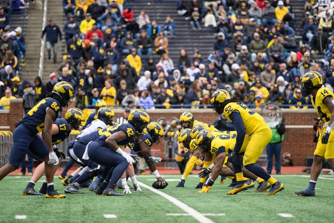 The two teams line up in the fourth quarter of the annual spring game at Michigan Stadium.