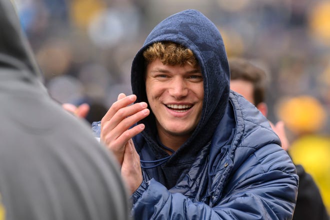 Former Michigan quarterback J.J. McCarthy watches during the fourth quarter of the annual spring game at Michigan Stadium.