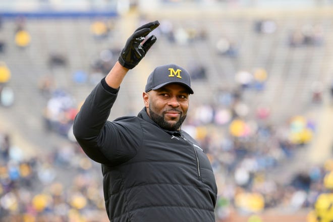 Head coach Sherrone Moore waves to the fans in the fourth quarter of the annual spring game at Michigan Stadium.