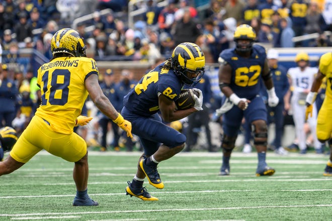 Team Blue wide receiver Dale Chesson runs the ball in the fourth quarter of the annual spring game at Michigan Stadium.