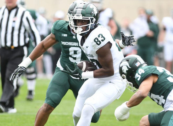 Tight end Ademola Faleye pulls in a reception during the Michigan State football's spring showcase/scrimmage at Spartan Stadium.
