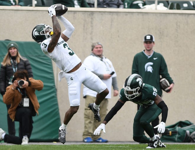 Wide receiver Montorie Foster Jr. pulls in a long reception during the Michigan State football's spring showcase/scrimmage at Spartan Stadium.
