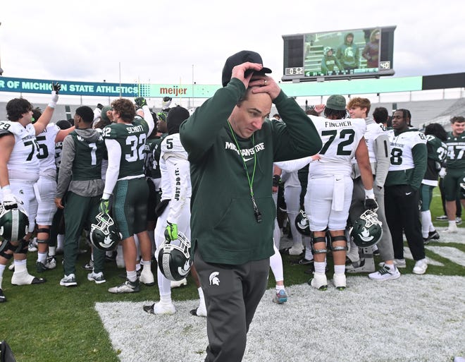 MSU football head coach Jonathan Smith breaks after the huddle with the team after the Michigan State football's spring showcase/scrimmage at Spartan Stadium.