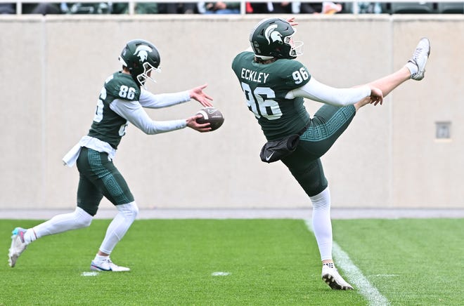 Punters Carson Voss and Ryan Eckley work during the Michigan State football's spring showcase/scrimmage at Spartan Stadium in East Lansing, Michigan on April 20, 2024.