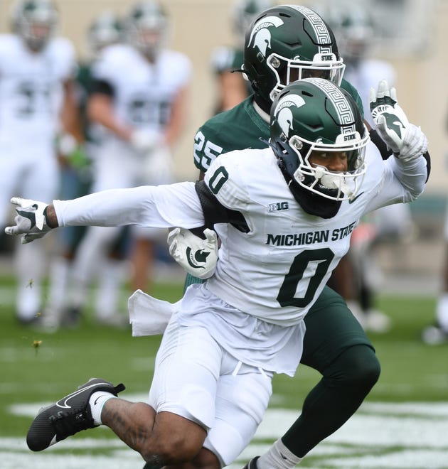 Wide receiver Alante Brown works against defensive back Chance Rucker at Michigan State football's spring showcase/scrimmage at Spartan Stadium in East Lansing, Michigan on April 20, 2024.