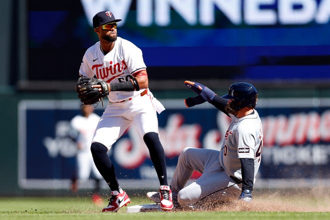 The Twins' Willi Castro, a former Tiger, fields the ball at second base for a forceout against the Tigers' Buddy Kennedy on a fielder's choice in the eighth inning.